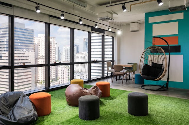 creative-room-coworking-space-with-cushions-chairs-artificial-grass-modern-office